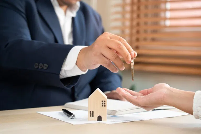 Ty Lacroix handing the keys to a buyer in London Ontario